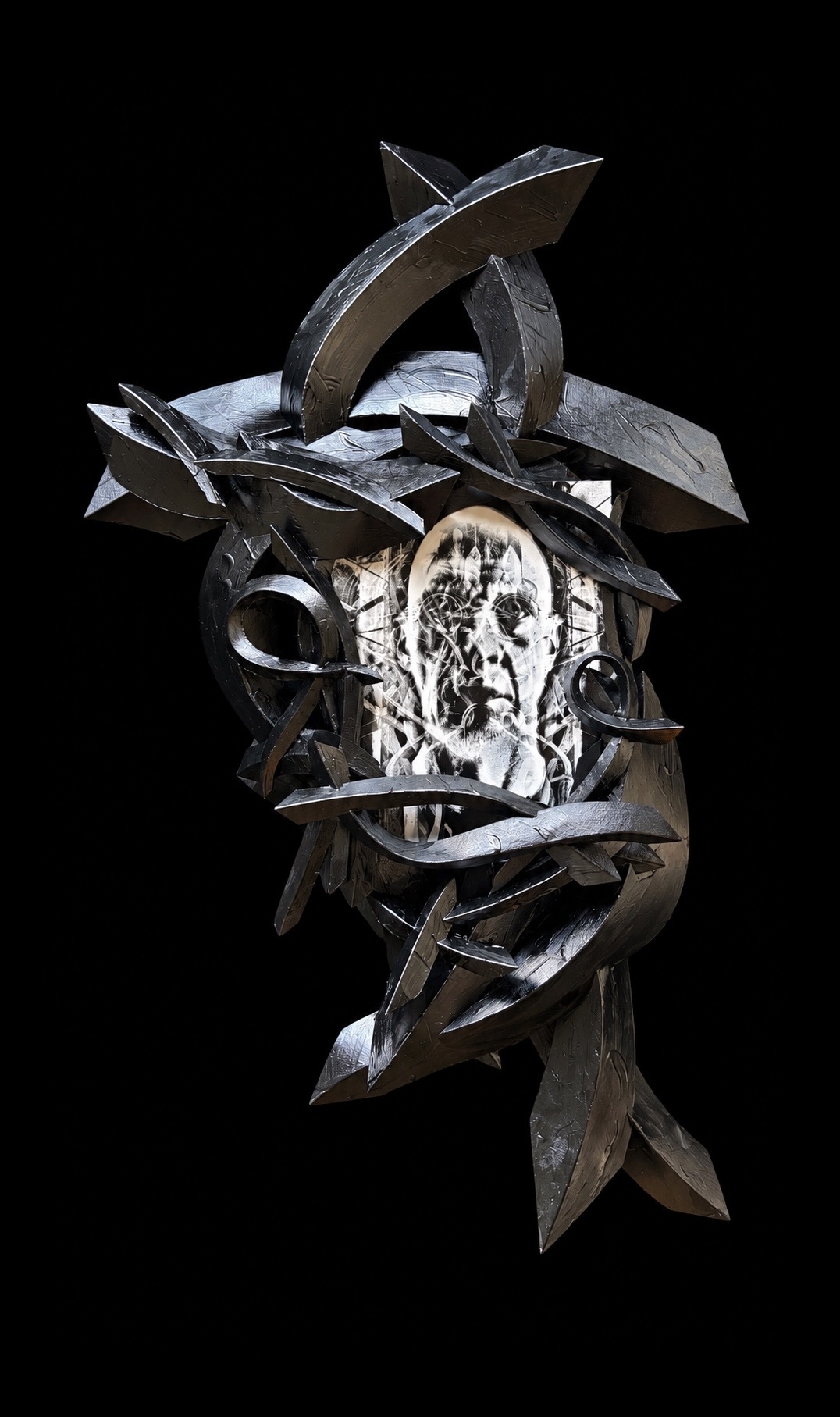 New sculptural construction with sweeping black forms surrounding a layered monochrome self-portrait