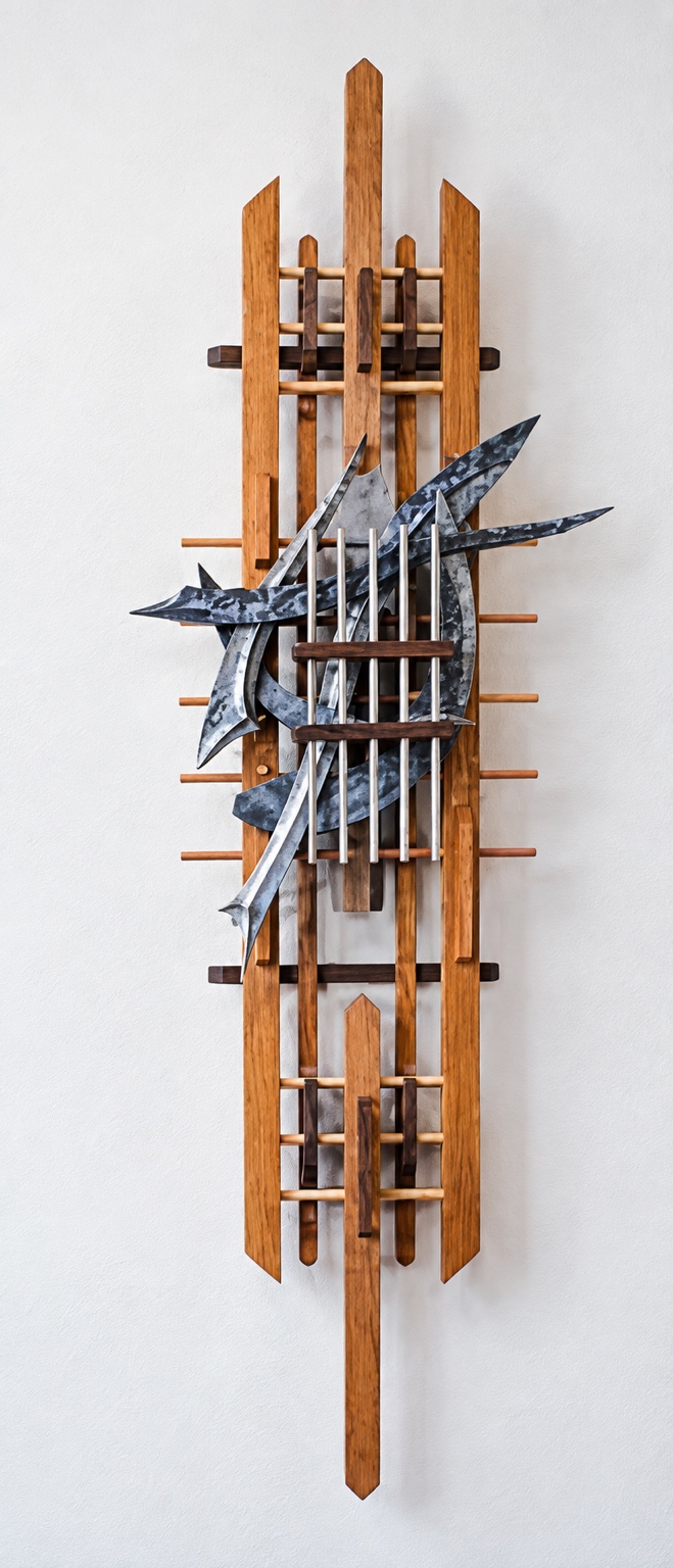 Tall wood construction with pointed and curved overlapping cast forms
